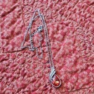 Elegant Silver Necklace with Vibrant Red Gemstone